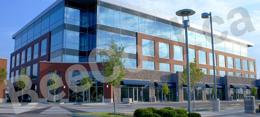 Large commercial glass window facades benefit from glare reduction heat reduction & UV protection.