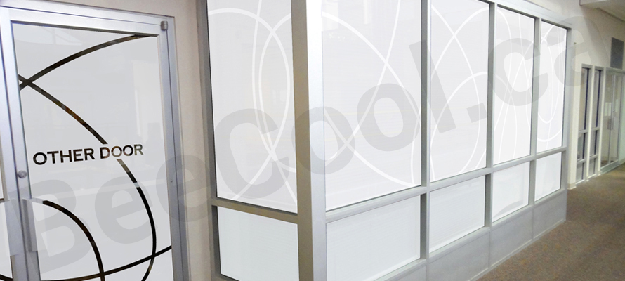 Interior office windows with decorative window frosting for privacy.