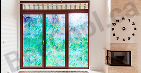 Interior photo of bathroom with decorative film installed on shower glass.